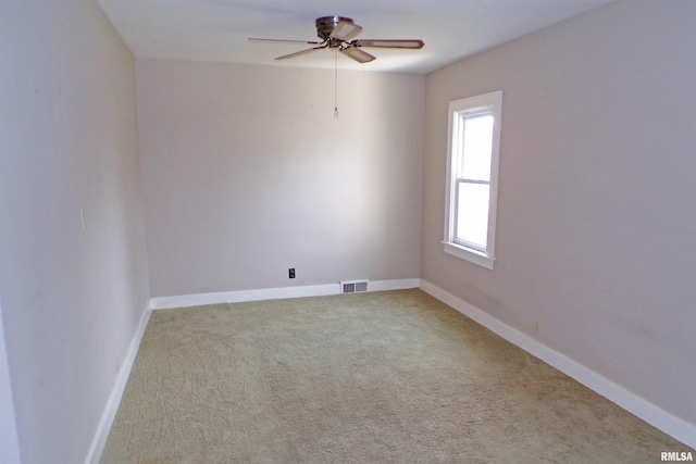 unfurnished room featuring carpet flooring and ceiling fan