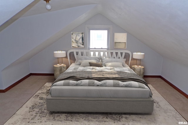 bedroom with carpet flooring and lofted ceiling