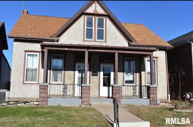 view of front of home featuring central AC unit and covered porch