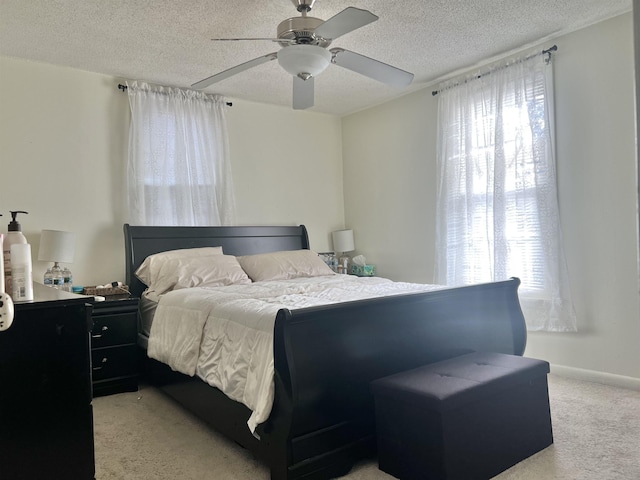 2307 Farnam St, Davenport, IA 52803 - bedroom with light colored carpet, a textured ceiling, and a ceiling fan
