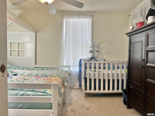 2307 Farnam St, Davenport, IA 52803 - carpeted bedroom featuring a textured ceiling and ceiling fan