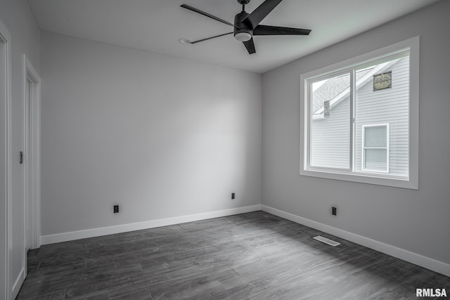 1915 E 59th Ct, Davenport, IA 52807 - unfurnished room with a ceiling fan and dark wood-style flooring