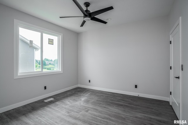 1915 E 59th Ct, Davenport, IA 52807 - unfurnished room with a ceiling fan and dark wood-type flooring
