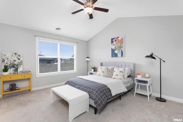 bedroom featuring ceiling fan, light carpet, and lofted ceiling