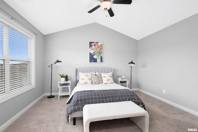 bedroom featuring carpet floors, vaulted ceiling, and ceiling fan