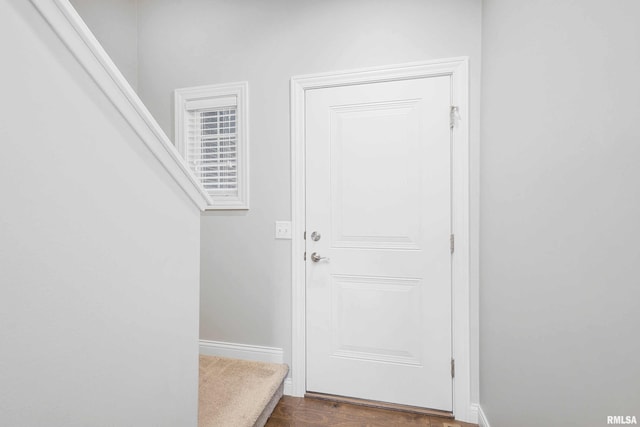 doorway to outside with dark wood-type flooring