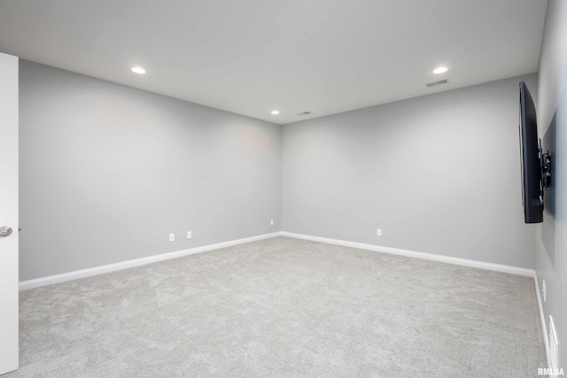 empty room featuring light colored carpet