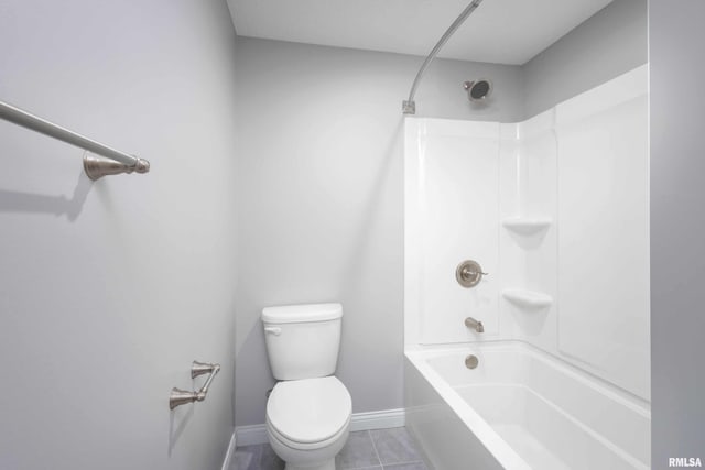 bathroom with tile patterned floors, toilet, and tub / shower combination