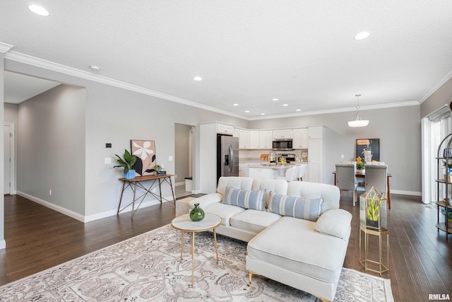 living room featuring a textured ceiling, dark hardwood / wood-style floors, and crown molding