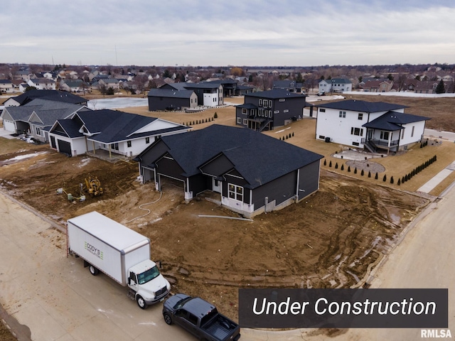 birds eye view of property with a residential view