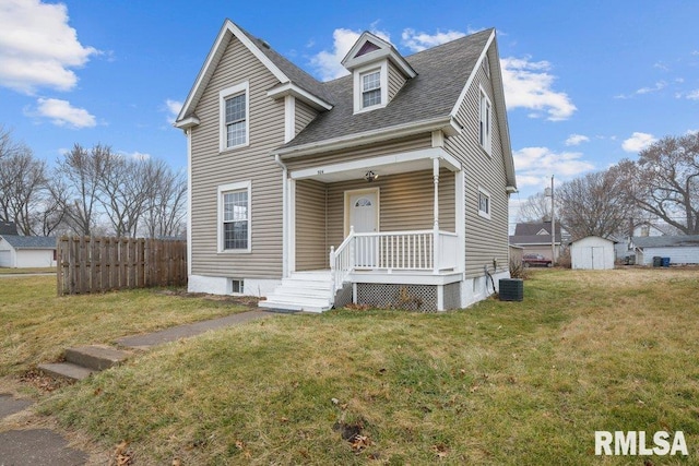 new england style home featuring a shed, central air condition unit, and a front yard