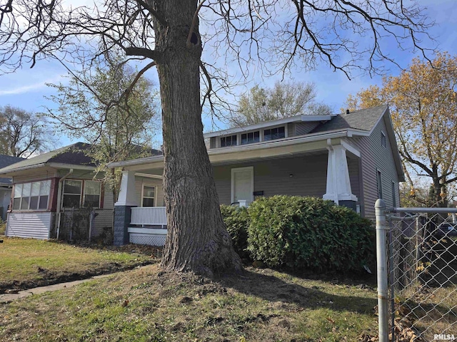 view of side of property with a porch