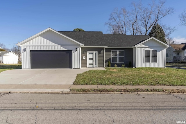 view of front facade with a garage and a front lawn