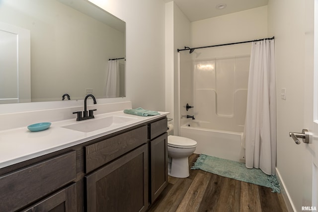 full bathroom with wood-type flooring, vanity, toilet, and shower / bath combo with shower curtain