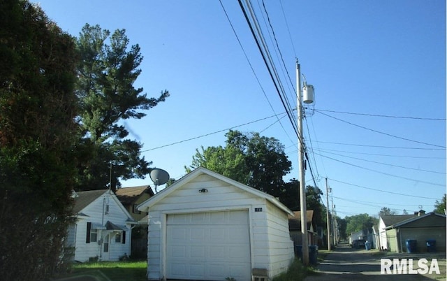 exterior space featuring an outbuilding and a garage