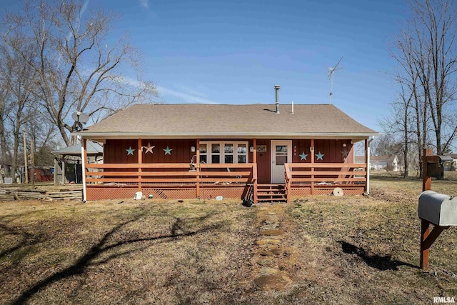 view of front of house featuring board and batten siding and a shingled roof