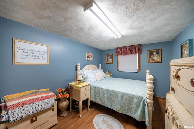 bedroom with wood finished floors