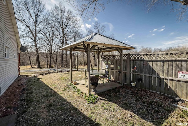 view of yard with a gazebo, a patio, and fence