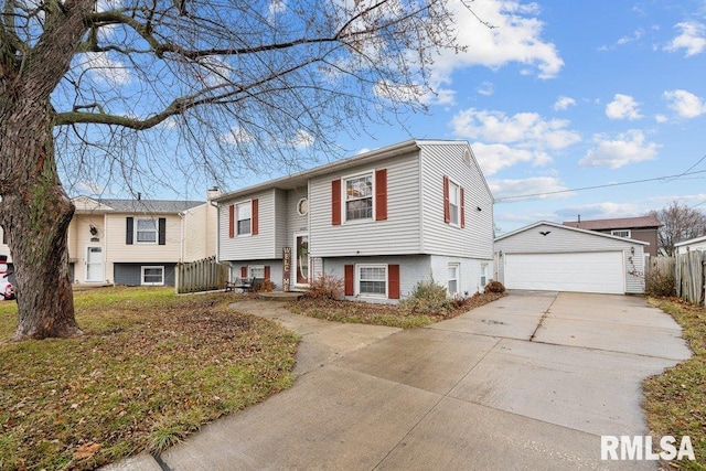 split foyer home with a garage and an outbuilding