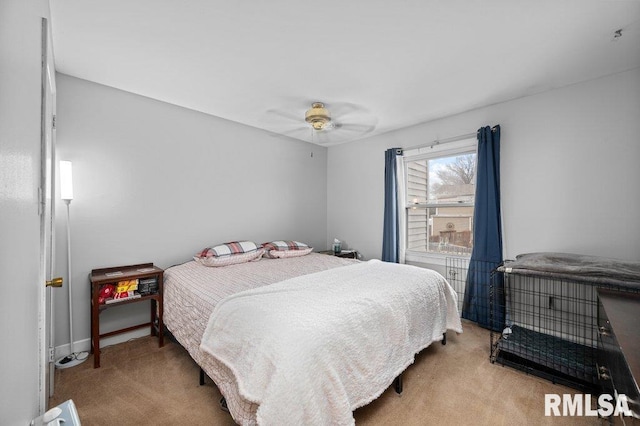 carpeted bedroom with ceiling fan