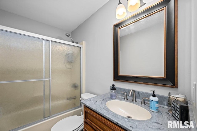 full bathroom with shower / bath combination with glass door, vanity, and toilet