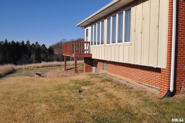 view of yard with a wooden deck