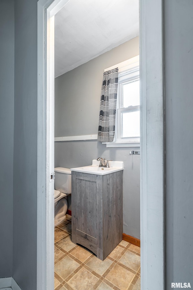 bathroom featuring toilet and sink