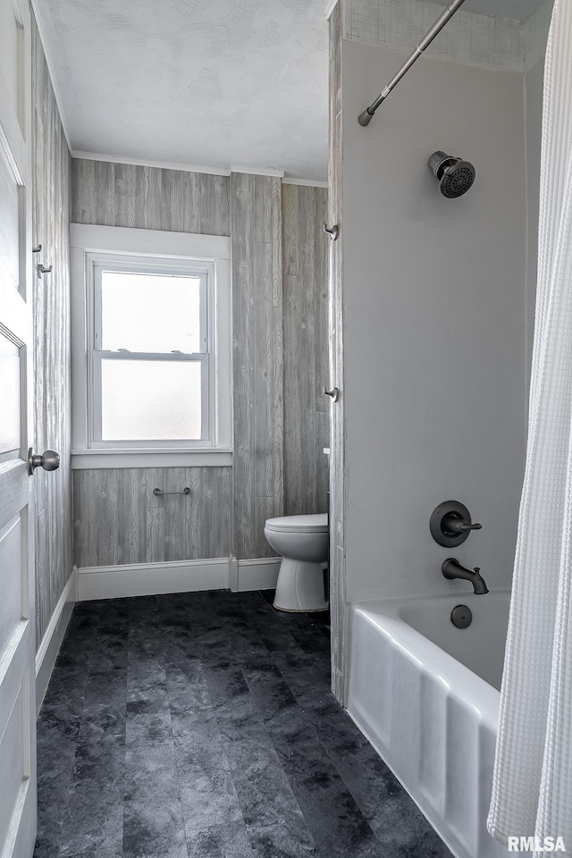 bathroom featuring toilet and shower / bathtub combination with curtain