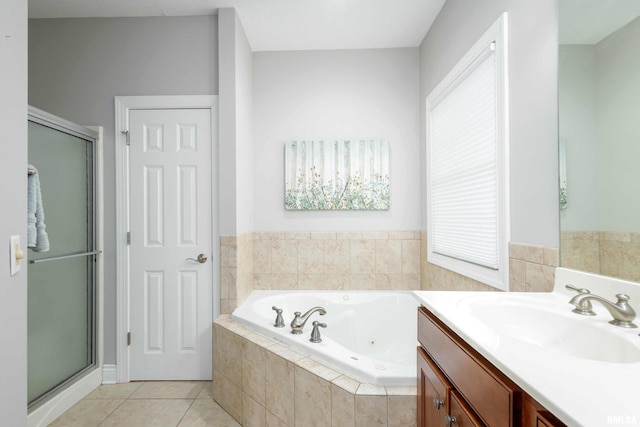 bathroom featuring tile patterned flooring, vanity, and separate shower and tub