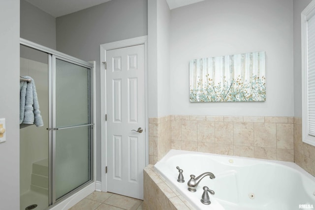 bathroom with tile patterned floors and plus walk in shower