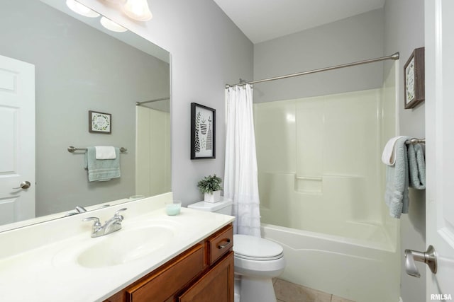 full bathroom featuring tile patterned flooring, shower / tub combo with curtain, vanity, and toilet