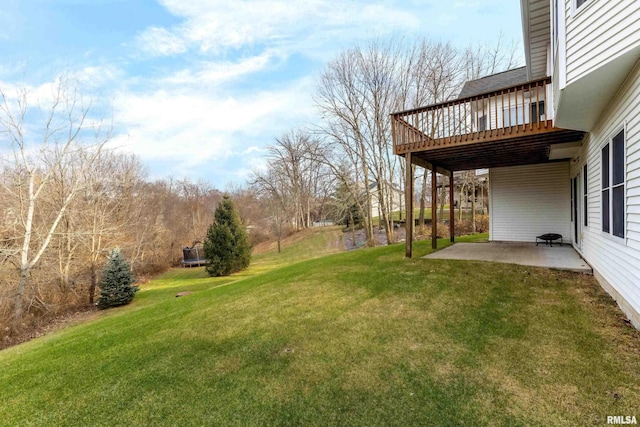 view of yard with a patio and a deck