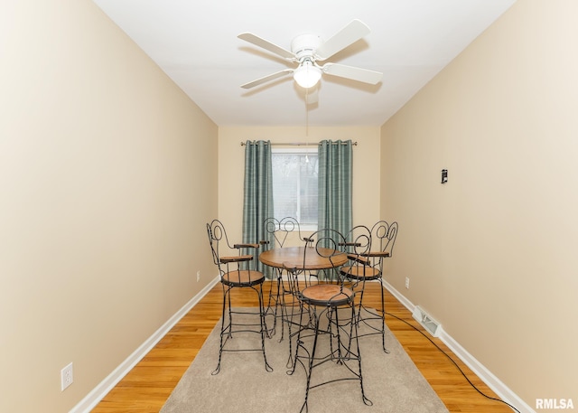 dining space featuring hardwood / wood-style floors and ceiling fan