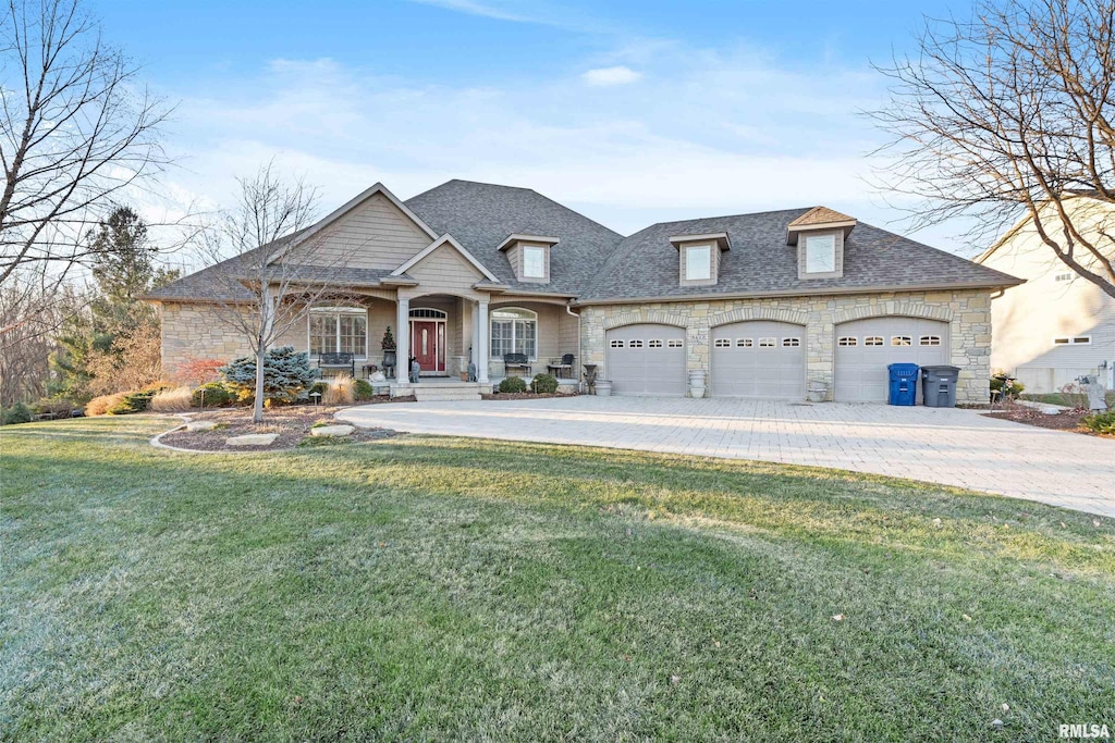 view of front of home featuring a garage and a front yard