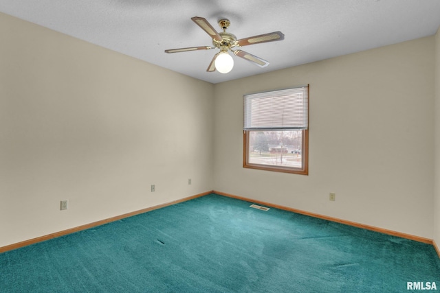 carpeted empty room with ceiling fan