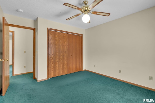 unfurnished bedroom featuring ceiling fan, dark carpet, and a closet