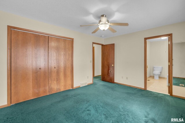 unfurnished bedroom featuring ensuite bath, ceiling fan, a closet, and light colored carpet