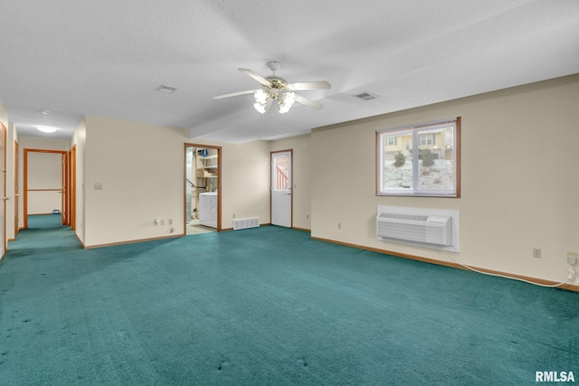 unfurnished room with carpet flooring, ceiling fan, a textured ceiling, and a wall mounted AC