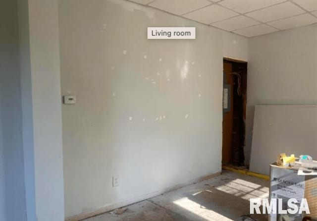 unfurnished room featuring a paneled ceiling