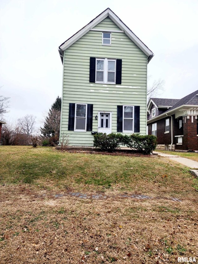 view of property featuring a front yard