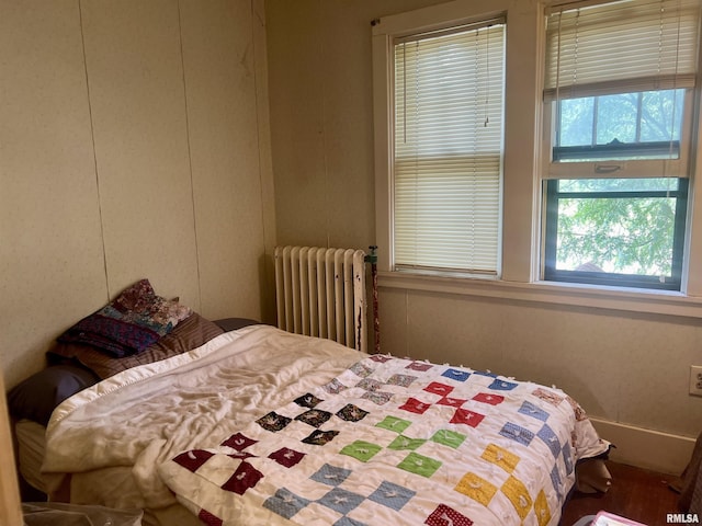 bedroom featuring radiator