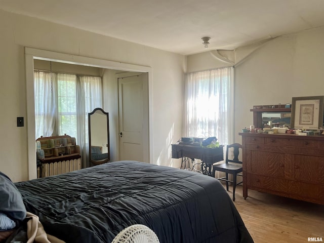 bedroom with light hardwood / wood-style floors