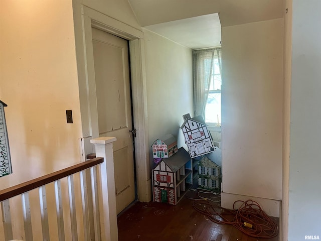 corridor with dark hardwood / wood-style floors