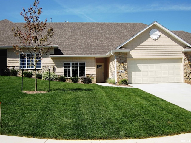 single story home featuring a front yard and a garage