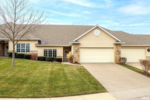 ranch-style house with a garage and a front lawn