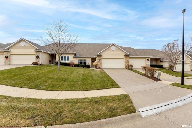 single story home with a garage and a front lawn