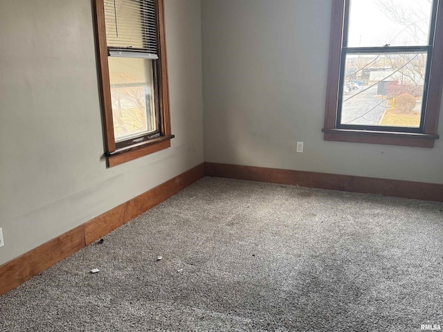 unfurnished room with carpet flooring