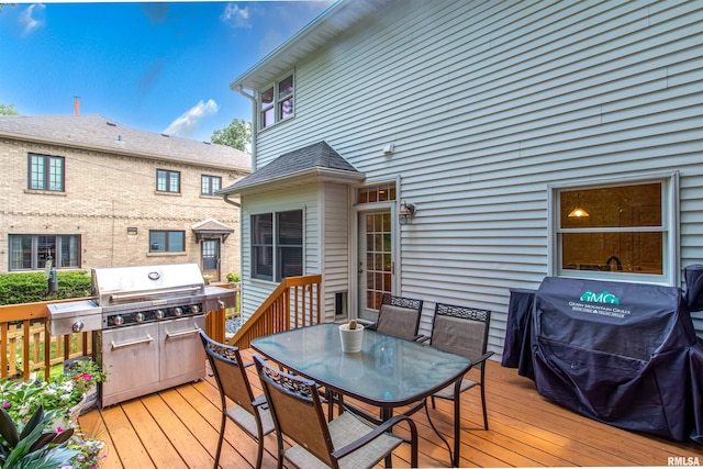 wooden terrace featuring area for grilling