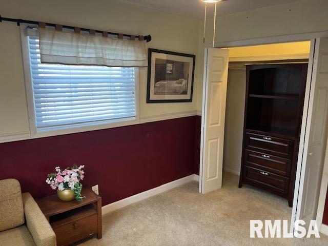 unfurnished bedroom featuring light colored carpet