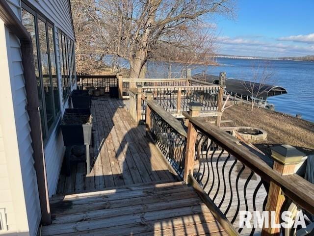 wooden terrace with a water view